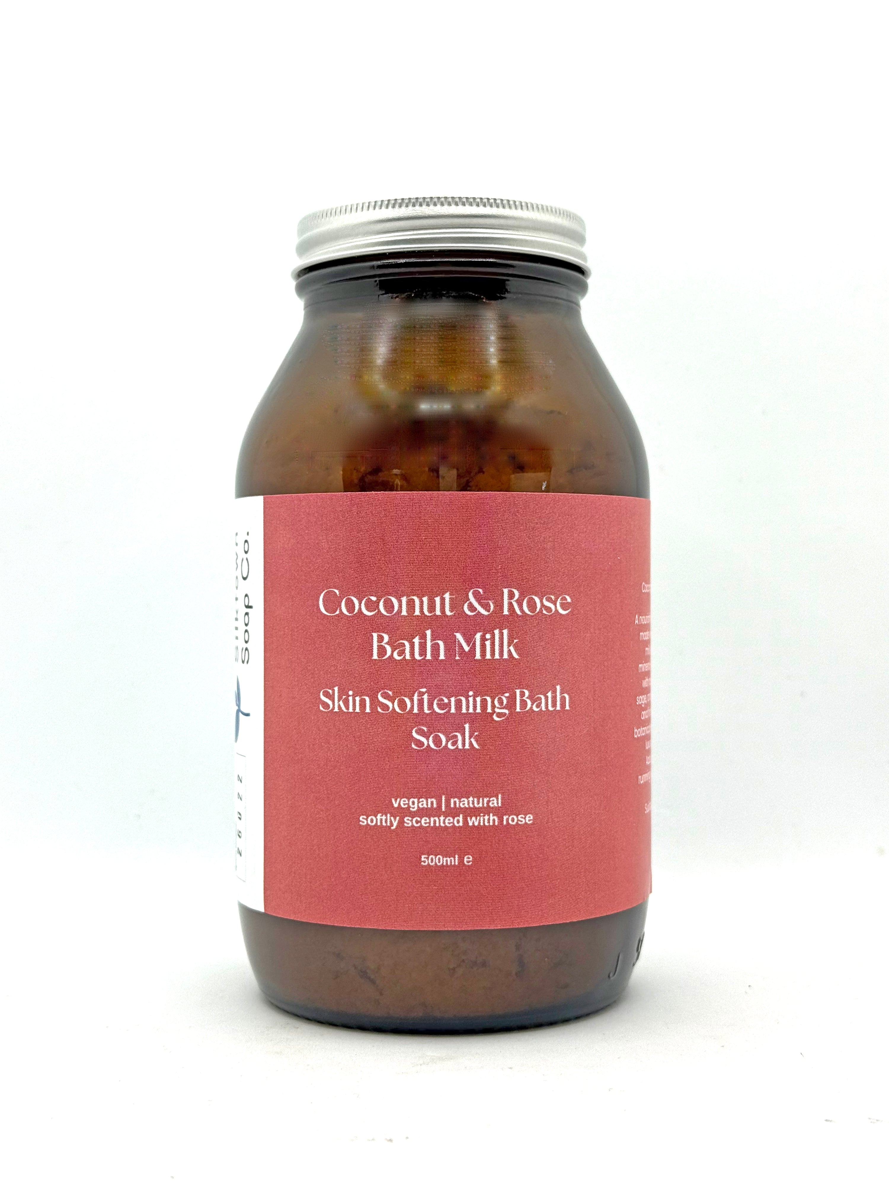 Bottle of Coconut & Rose Bath Milk on a white background