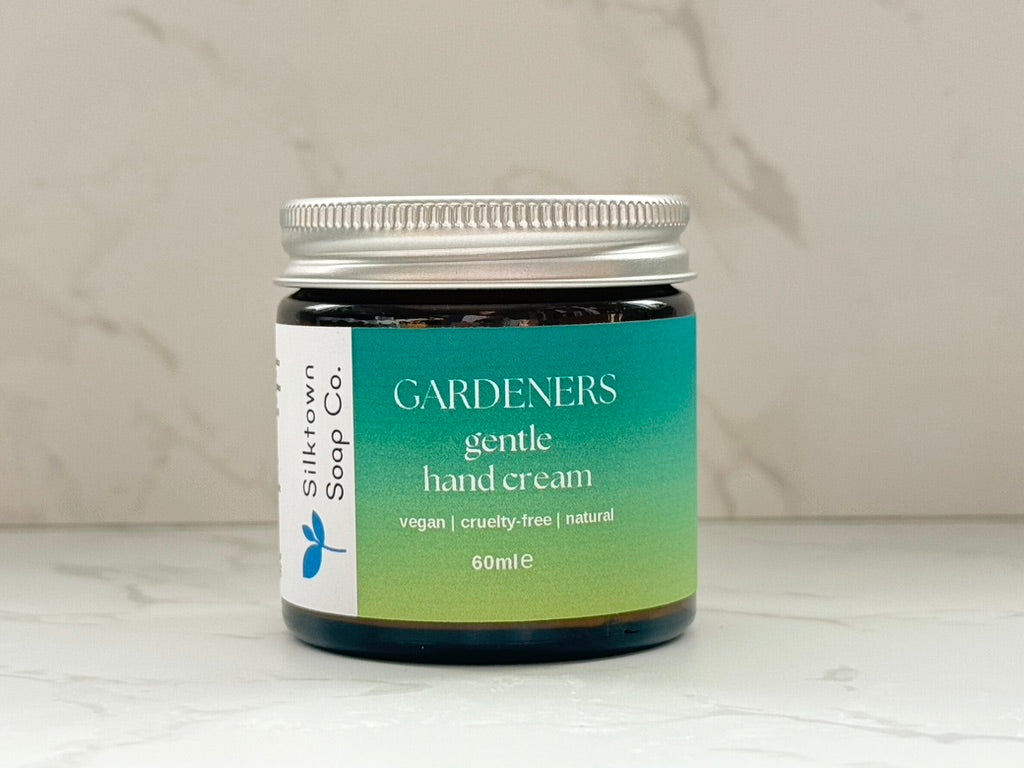 Jar of Silkscreen Soap Co. Natural Hand Cream - Gardeners Herbal on a neutral background