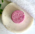 Natural Shampoo Bar - Talisman on a white marble surface with green leaves