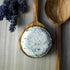 Lavender Lullaby Natural Skincare Bath Bomb with wooden spoons and lavender sprig