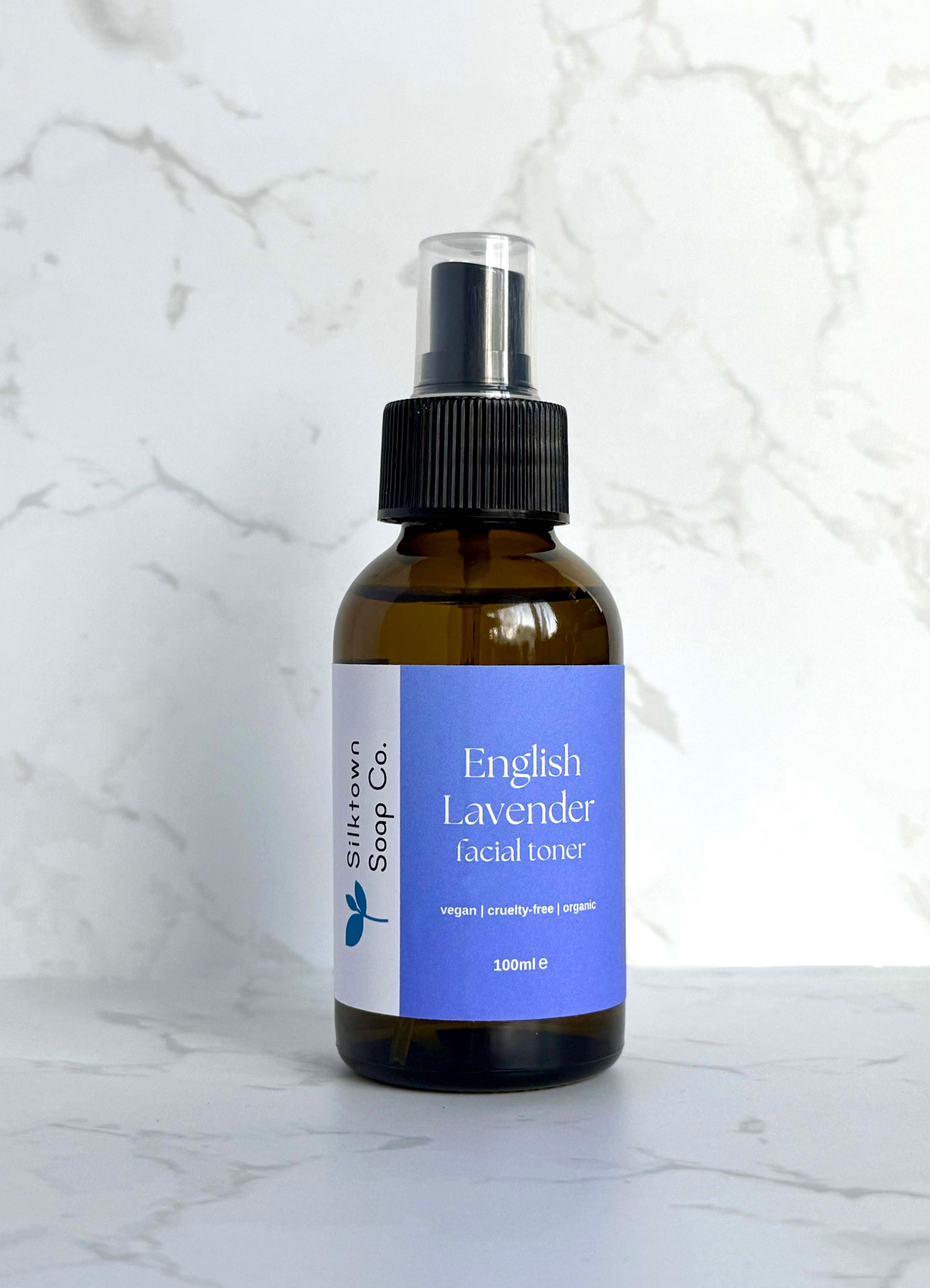 Bottle of Natural Facial Toner English Lavender and marble background