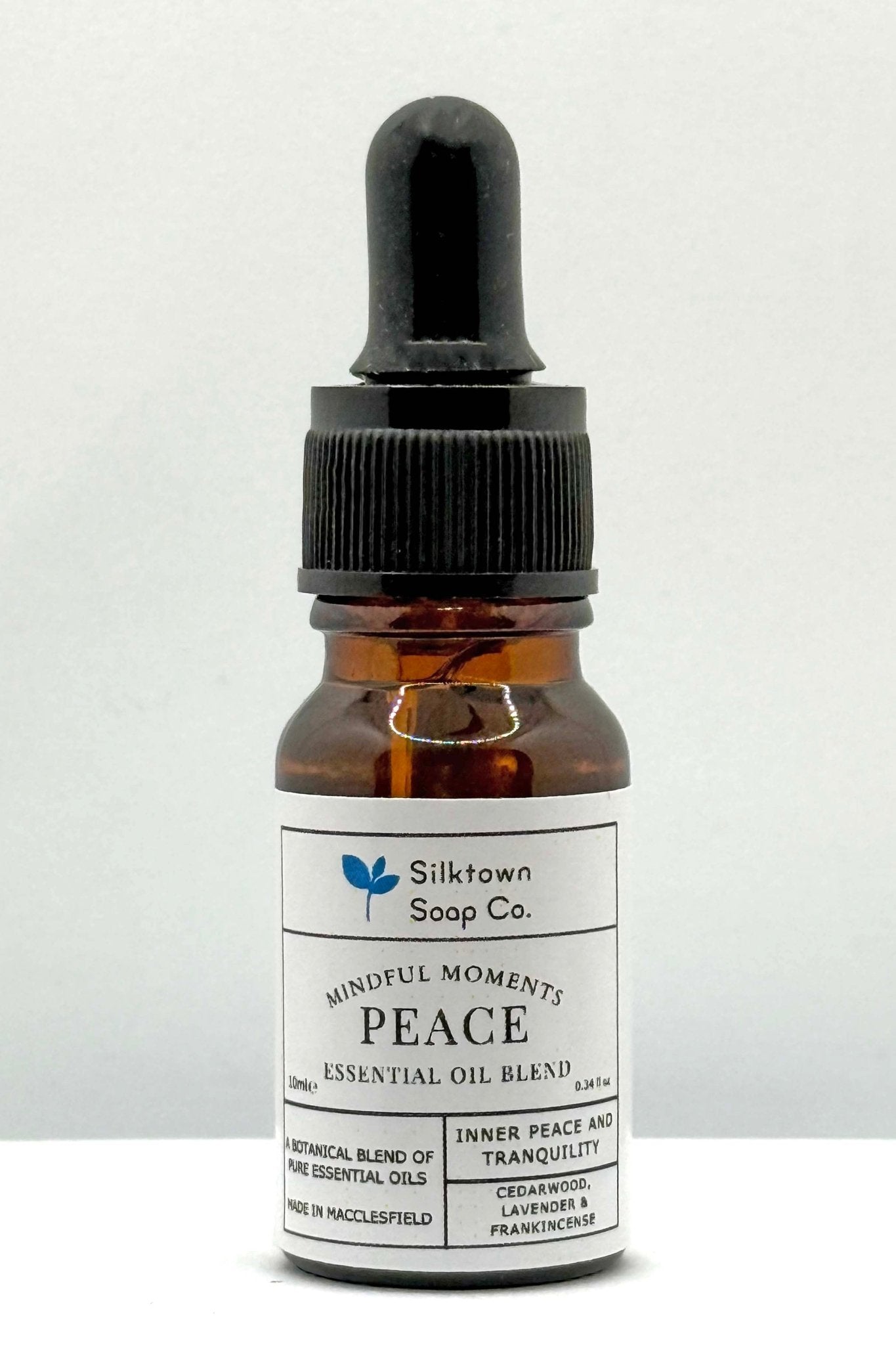 A small glass bottle with a dropper filled with &