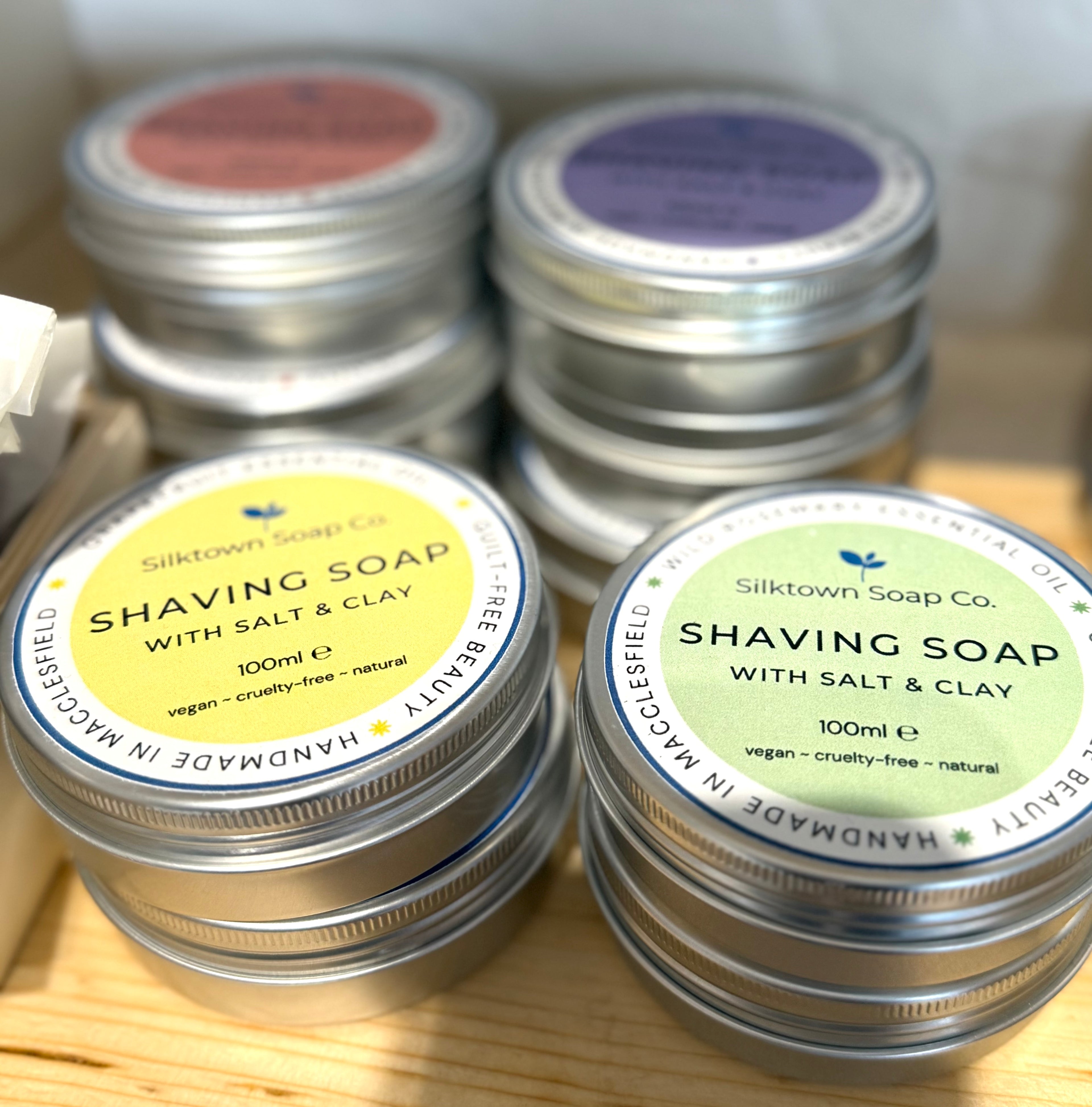 selection of Natural Soap for Shaving in tins on a shop shelf