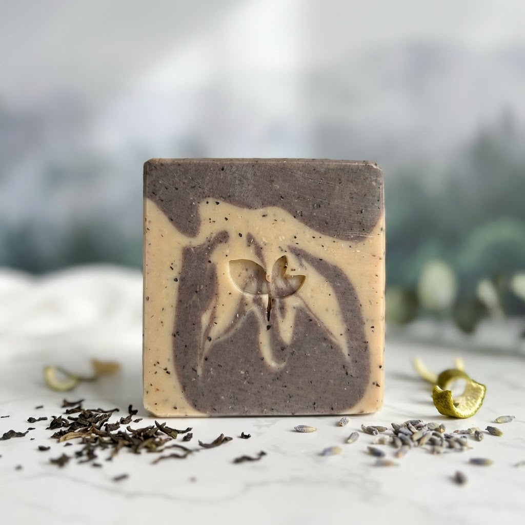 Square bar of soap with natural ingredients on a light surface