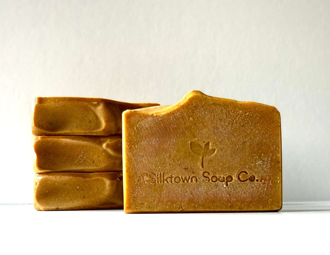 Four bars of natural soap from Silktown Soap Co. on a white background