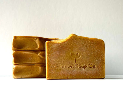 Four bars of natural soap from Silktown Soap Co. on a white background