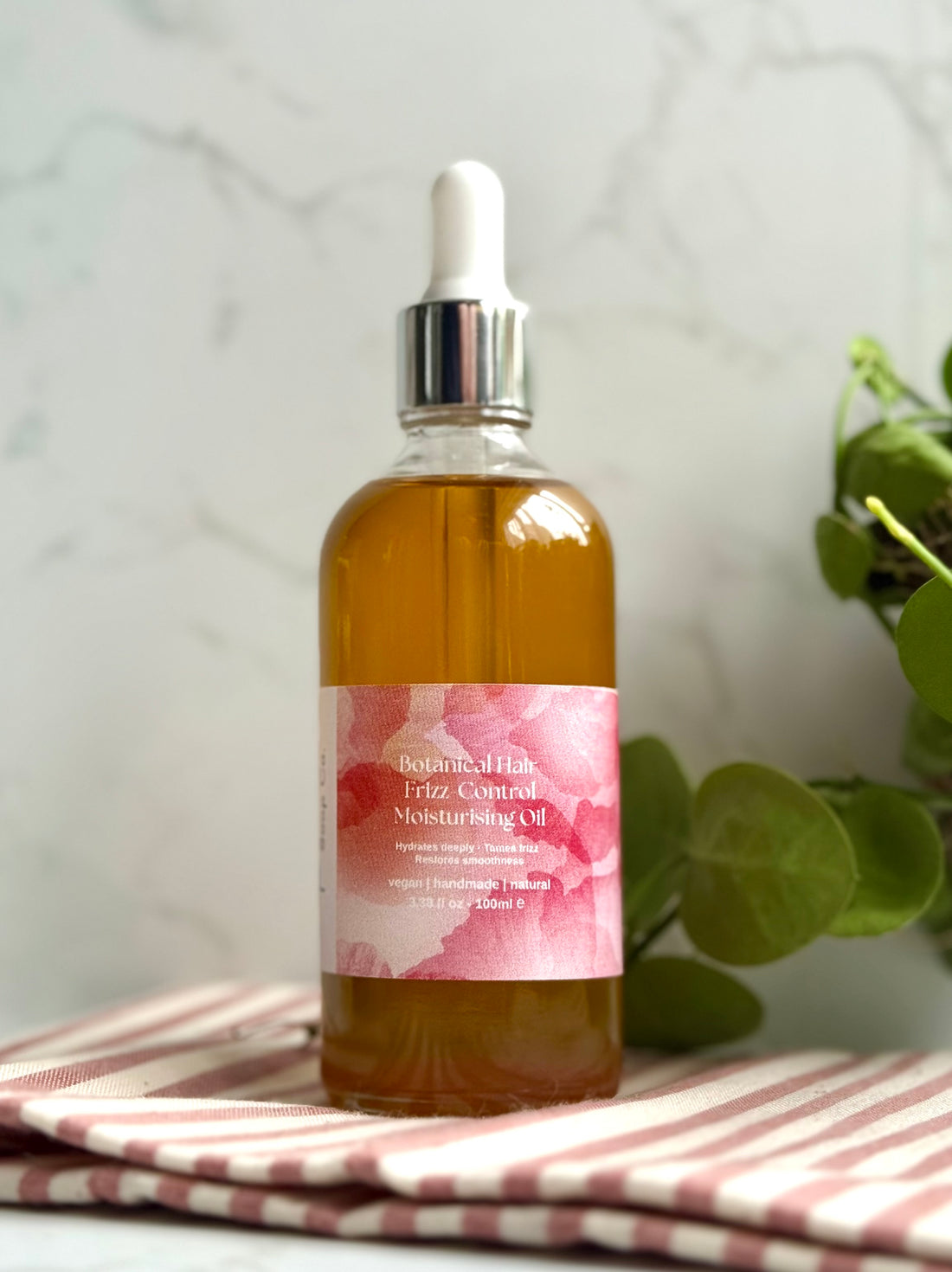 Botanical hair oil for frizzy hair  