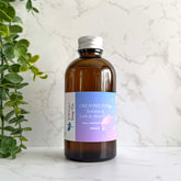 Dreamweaver - Handmade Botanical Skincare Oil bottle, 200ml from Silktown Soap Co., displayed with a plant backdrop, showcasing its calming design.