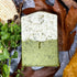 Gardeners Herbal natural Soap bar on stone with leaves and wood