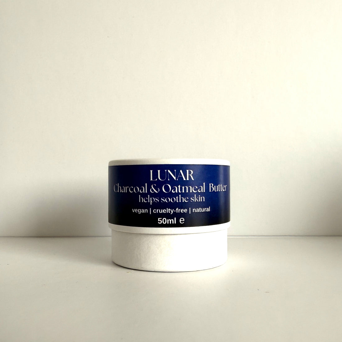 Jar of Lunar Charcoal &amp; Oatmeal Butter on a white background