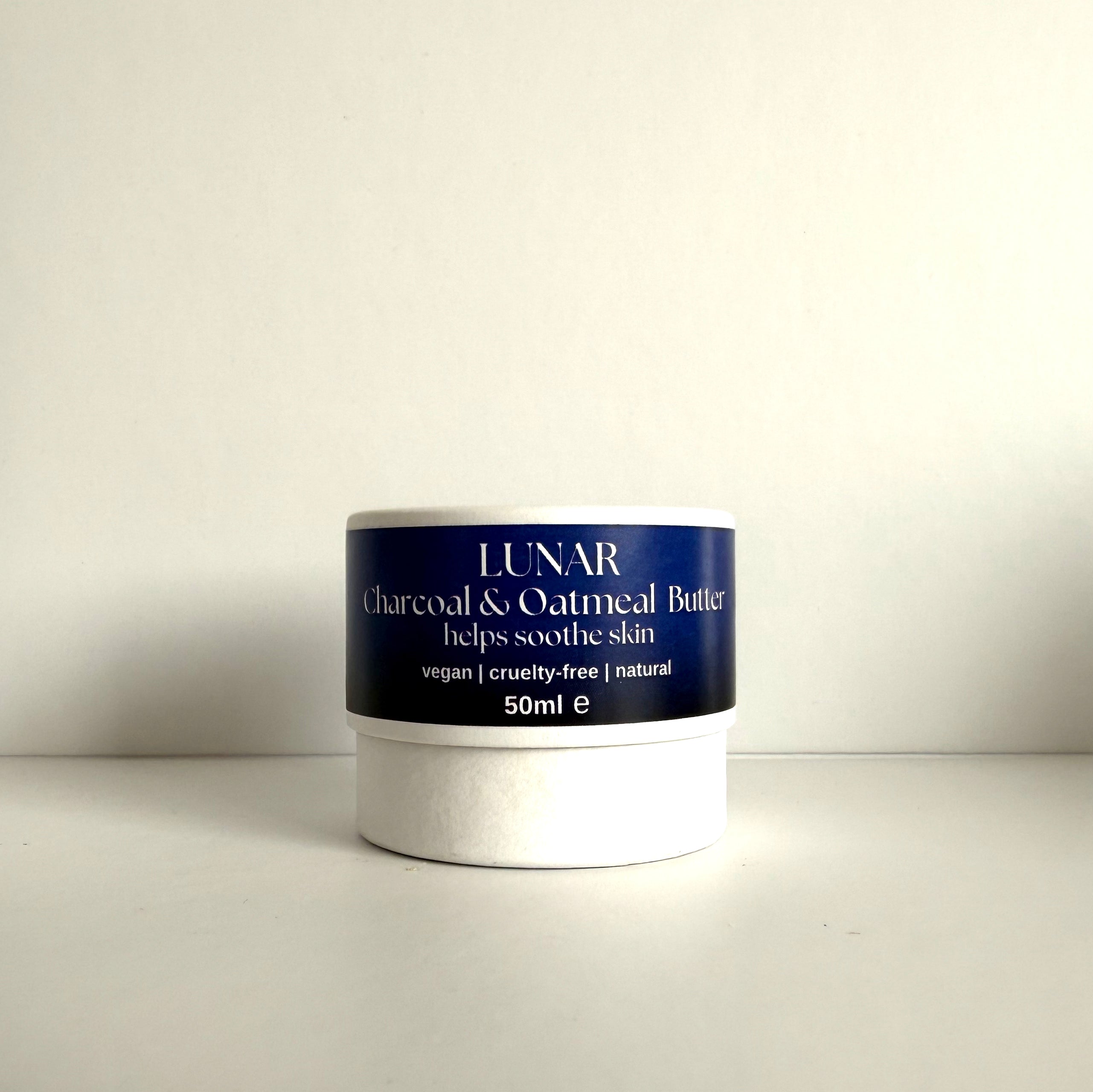 Jar of Lunar Charcoal &amp; Oatmeal Butter on a white background