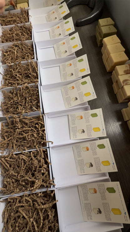 Sun and Moon collection handmade soaps being assembled in boxes