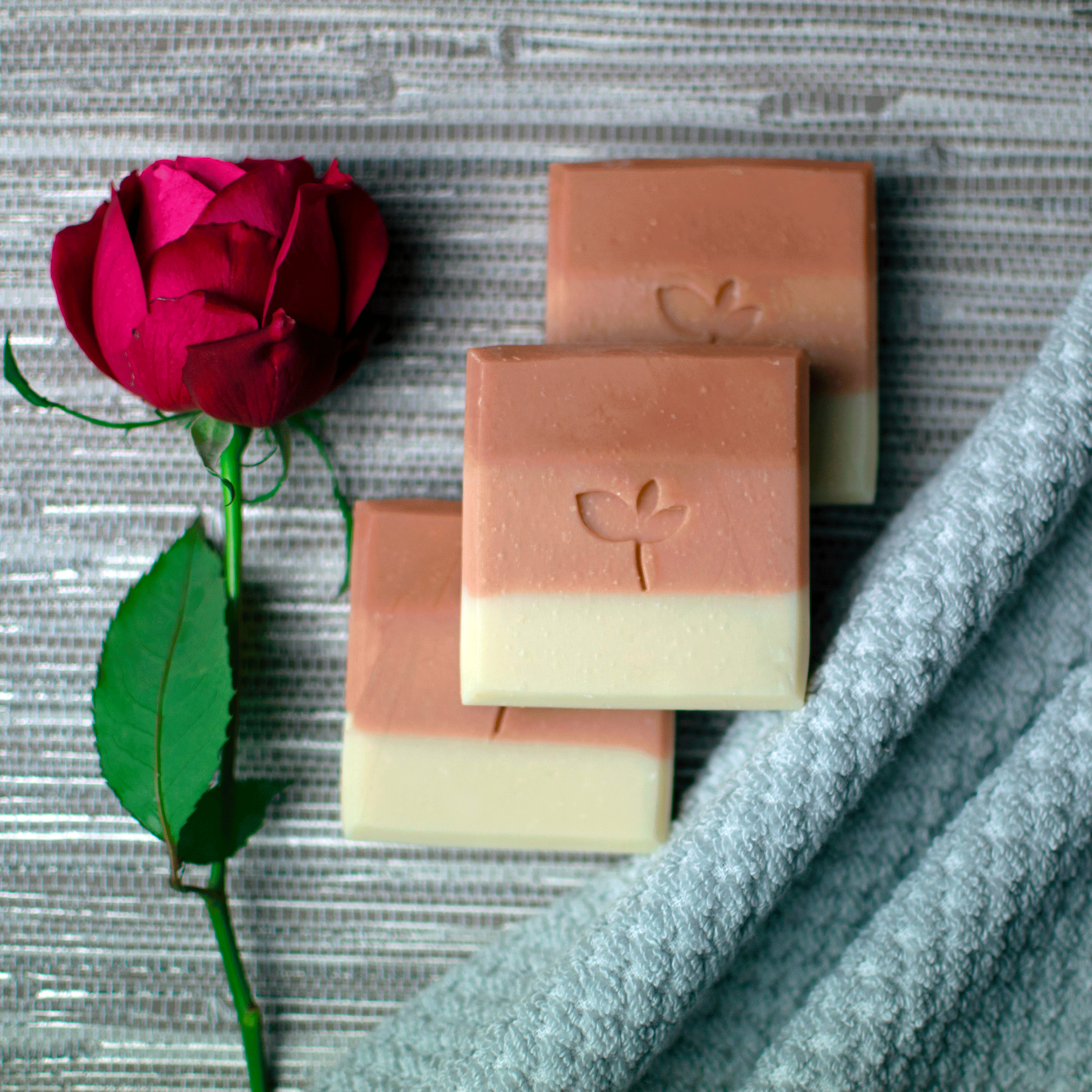 Midsummer Meadow natural soap bars with a rose and towel 