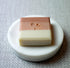 Midsummer Meadow natural soap bar with geranium on a dish