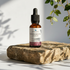 Nourishing face oil on stone with plants