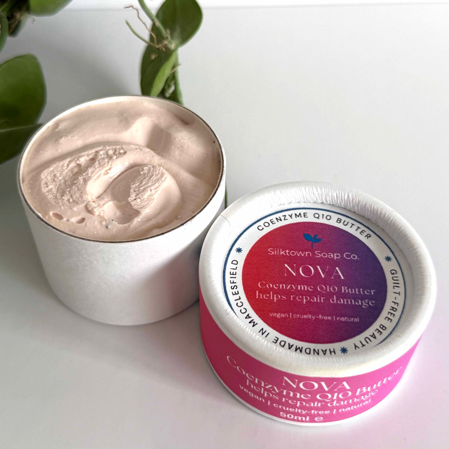 Silktown Soap Co. Nova Coenzyme Q10 Butter container with lid off on a white surface.