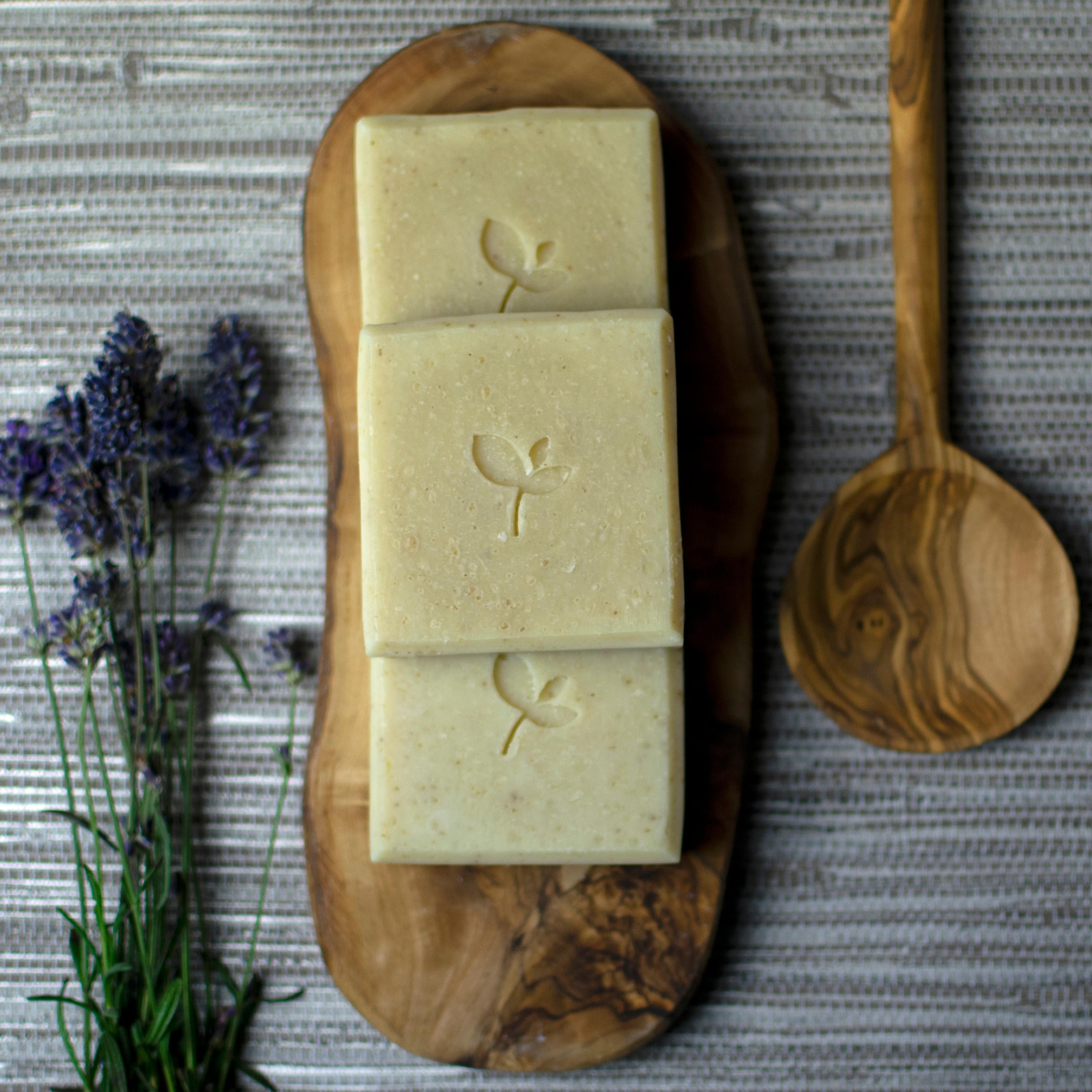 Oatmilk natural soap bar with wooden spoon and lavender