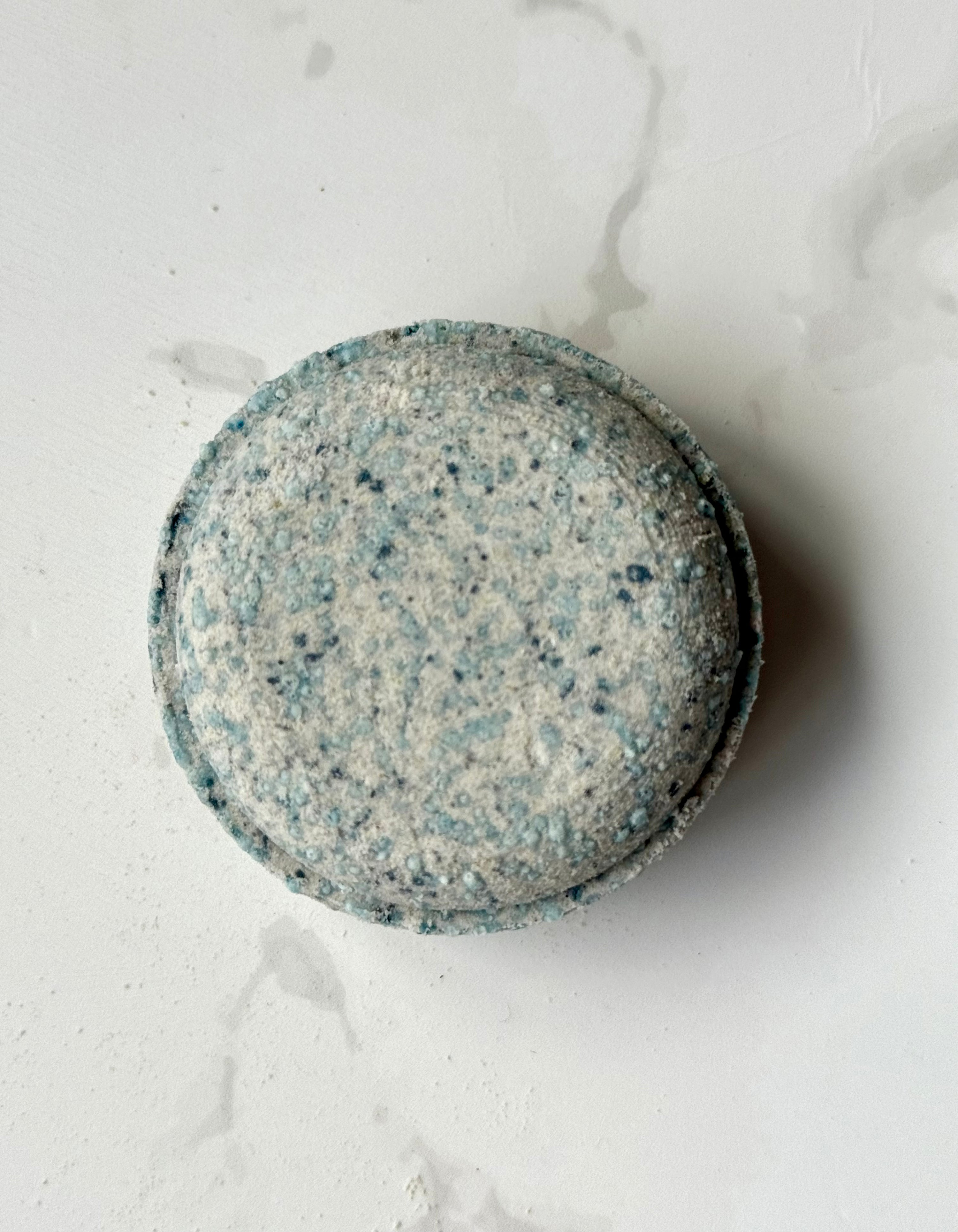 Peppermint and Eucalyptus Aromatherapy Shower Steamer on a marble background
