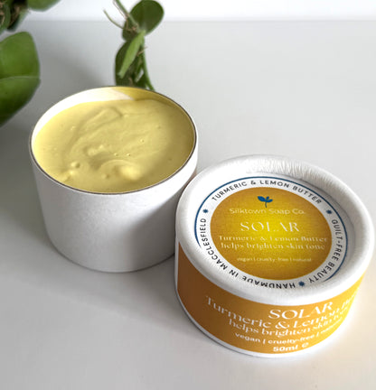 white container of cream with a lid showing &