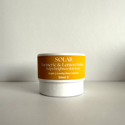 Jar of Solar Turmeric &amp; Lemon Butter on a light gray background