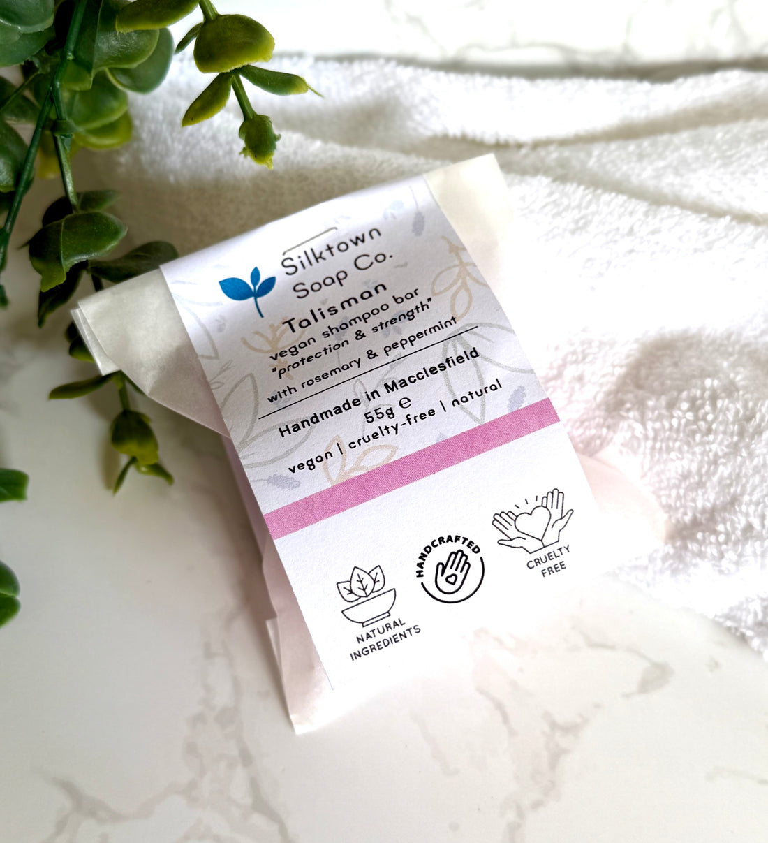 Silkatown Soap Co. Natural Shampoo Bar - Talisman packaging on a white surface with greenery
