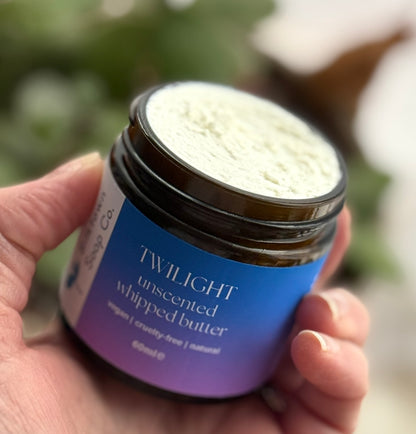 Twilight whipped Butter 60ml amber jar close up in hand