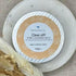 Tin of Natural Cleansing Balm - Clear Off! on a dish with dried foliage

