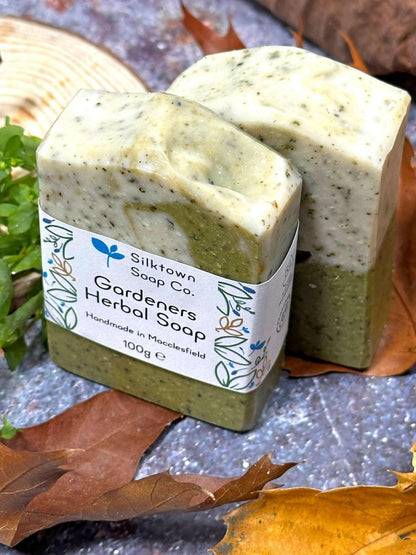 labelled Gardeners Herbal natural Soap bar on stone with leaves and wood