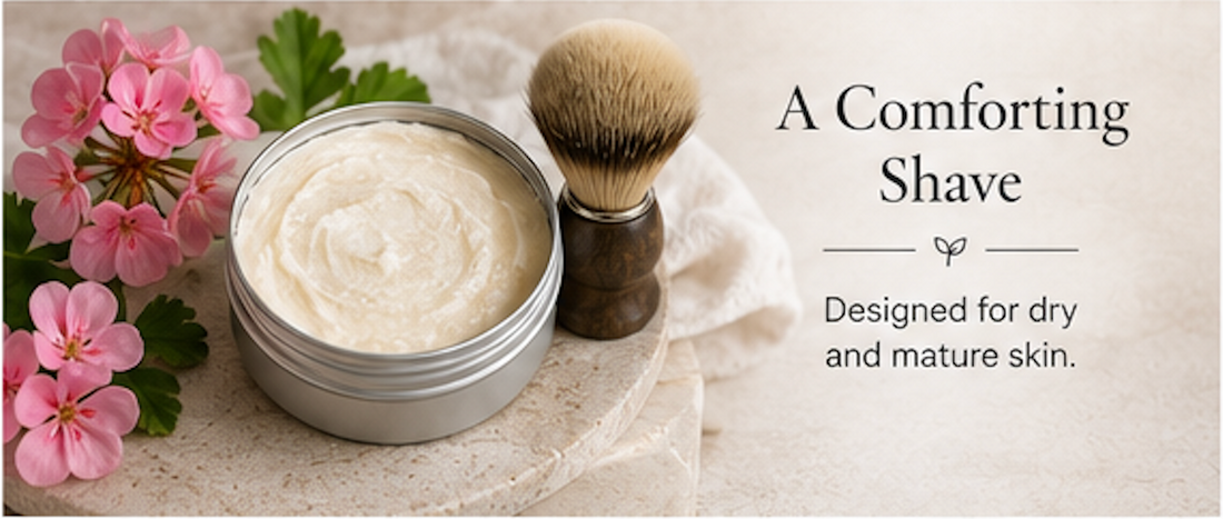 Jar of shaving cream with a brush and pink flowers on a light background