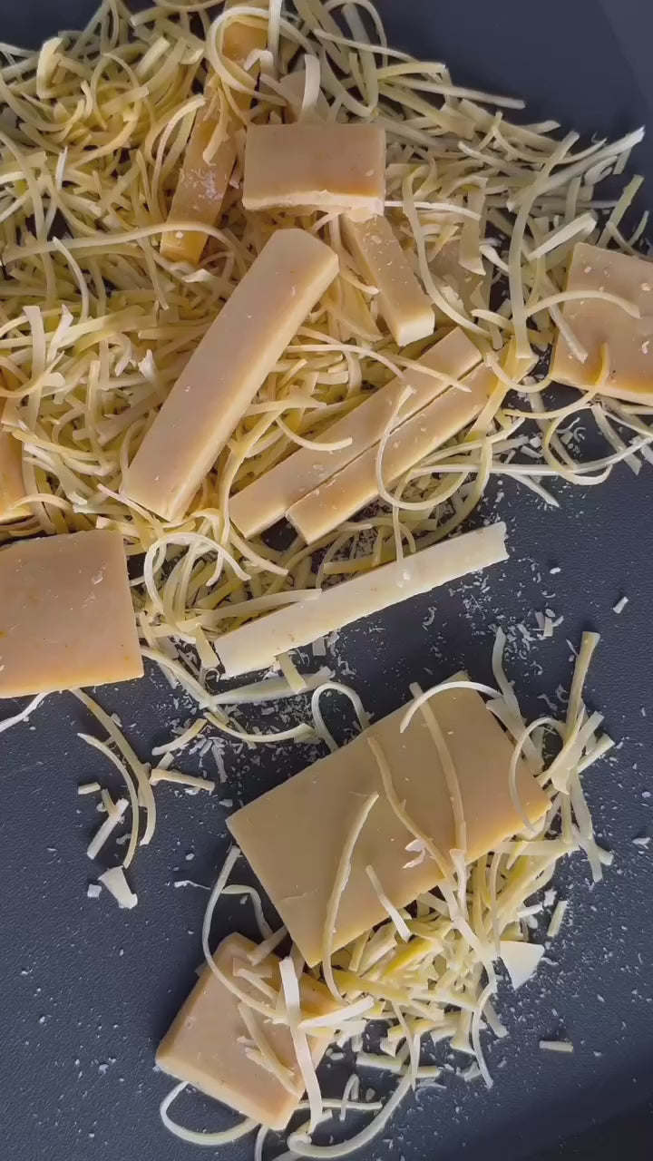 Natural soap scraps being put into a zero waste soap bag