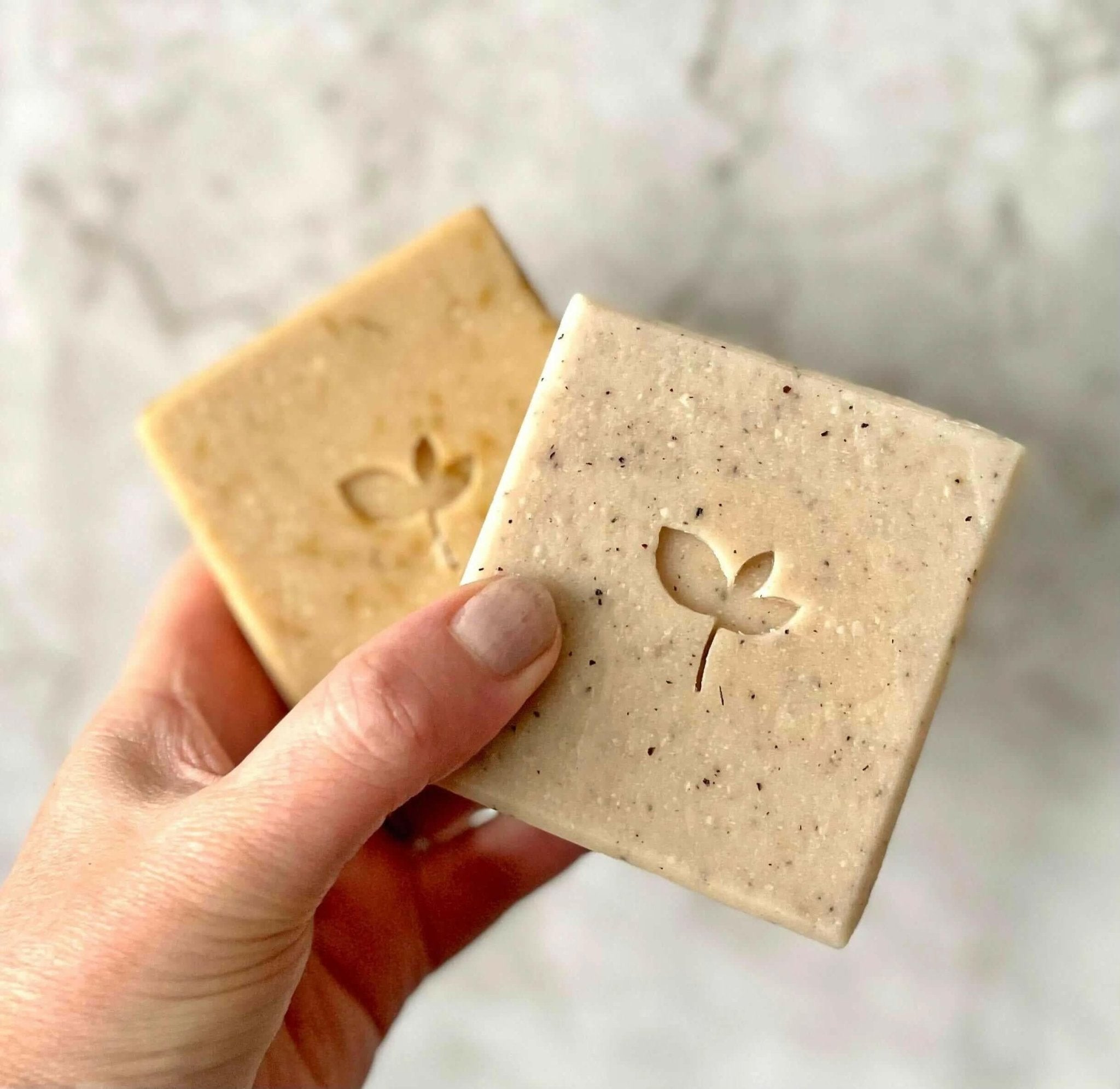 Natural Beauty Products Gift Card- a hand holding two handmade natural soap bars